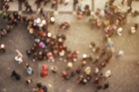 Blurred crowd of people in multicolored clothes in the city. Top viewの写真素材