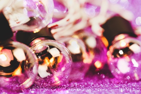 Glittering shine lights background with violet sparkles and many little bulbs. Festive background.の写真素材