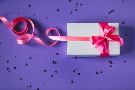 White present box with pink bowの写真素材