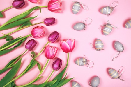 Tulips and easter eggs on pink