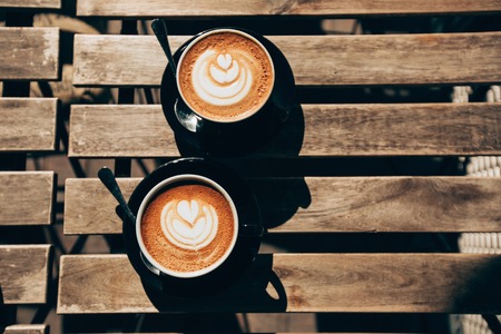 Two cups of cappuccino with latte artの写真素材