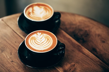 Two cups of cappuccino with latte artの写真素材