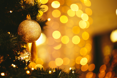 Fir branch with balls and festive lightsの写真素材