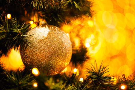Fir branch with balls and festive lightsの写真素材