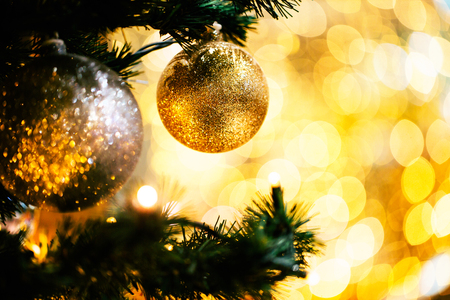 Fir branch with balls and festive lightsの写真素材