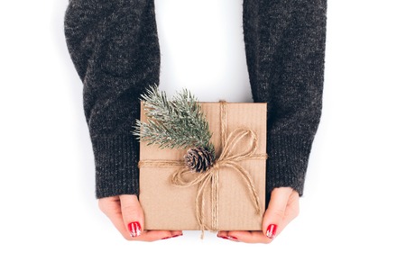 Womans hands wrapping Christmas gift boxの写真素材