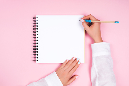 Spiral notepad with pencil as mockup for designの写真素材