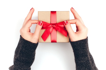 Womans hands with gift boxの写真素材
