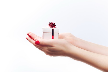 Womans hands with gift boxの写真素材