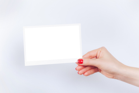 Hand with clean white card with frameの写真素材
