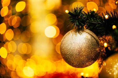 Fir branch with balls and festive lightsの写真素材
