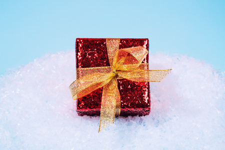 Red sparkling present with golden bowの写真素材