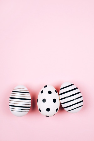 Three easter eggs on pink. Flat lay.の写真素材