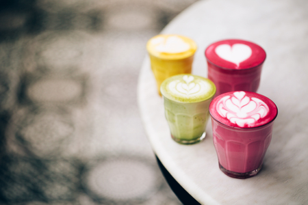 Trendy multicolored lattes.の写真素材