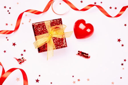 Red gift box with golden ribbonの写真素材
