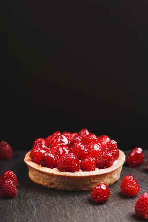 Tartlet with custard and fresh raspberriesの写真素材