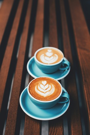 Two cups of cappuccino with latte artの写真素材