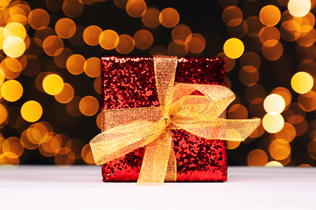 Red gift box with christmas lightsの写真素材