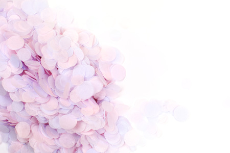 Pink pastel confetti on whiteの写真素材