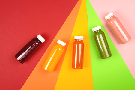 Bottles of multicolored smoothiesの写真素材