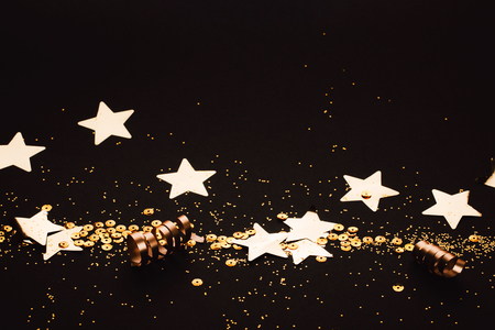 Golden stylish line of decoration on black background. Place for text. Festive concept.の写真素材