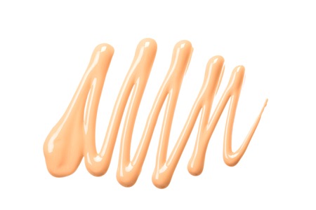 Smear of foundation. Cosmetics concept isolated on whiteの写真素材