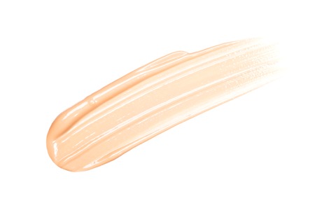 Smear of foundation. Cosmetics concept isolated on whiteの写真素材
