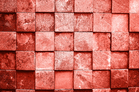 Stone wall made with squares. Living Coral Color of the year 2019. Main trend concept.の写真素材