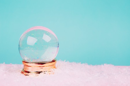 Beautiful snow ball on pink over blue pastel background.の写真素材