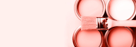 Banner with color of the year 2019 - Living Coral. Four open cans of paint Renovation concept.の写真素材