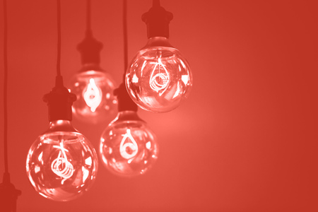 Group of Living Coral lamps with interesting shape of tungsten filament. Color of the year 2019....