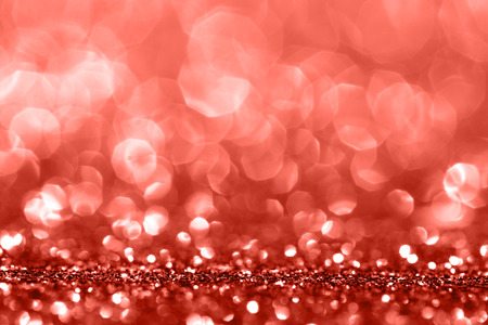Living Coral glitter bokeh background. Color of the year 2019. Main trend concept. Natural and authentic mood.の写真素材