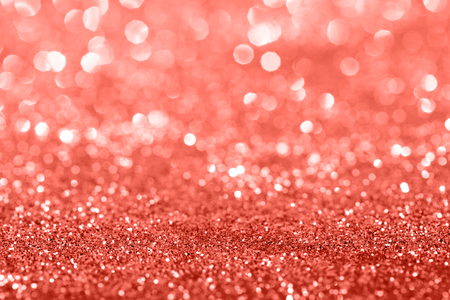 Living Coral glitter bokeh background. Color of the year 2019. Main trend concept. Natural and authentic mood.の写真素材