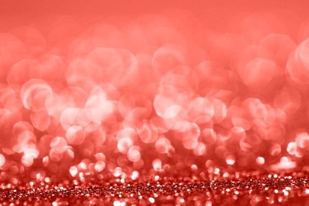 Living Coral glitter bokeh background. Color of the year 2019. Main trend concept. Natural and authentic mood.の写真素材