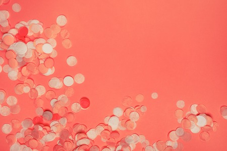 Colorful festive confetti. Flat lay style. Ispired by color of the year 2019 - Living Coral.の写真素材