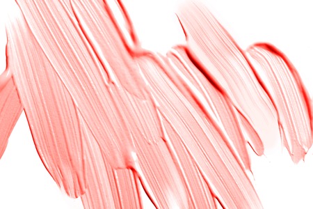Background made of liquid foundation. Make-up concept. Ispired by color of the year 2019 - Living Coral.の写真素材