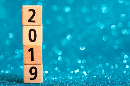 Vertical column of numbers 2019 on blue sparkling background. Place for text. Festive concept.の写真素材