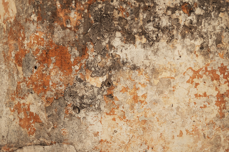 Grunge brown stone wall. Peeling paint with old concrete. Pattern of cement material.の写真素材
