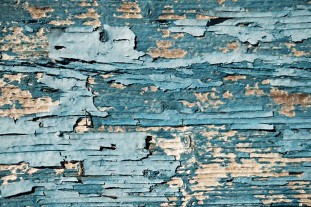 Texture of cracked painted peeling wooden background. Pattern of rustic grunge material.の写真素材