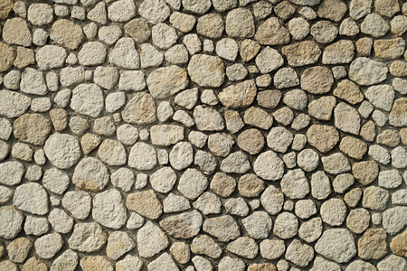 Beautiful accurate textured brick wall on bright sunny day. Stone background.の写真素材