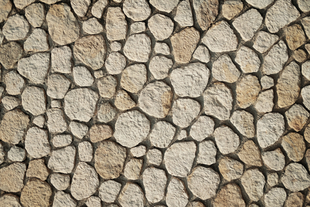 Beautiful accurate textured brick wall on bright sunny day. Stone background.の写真素材