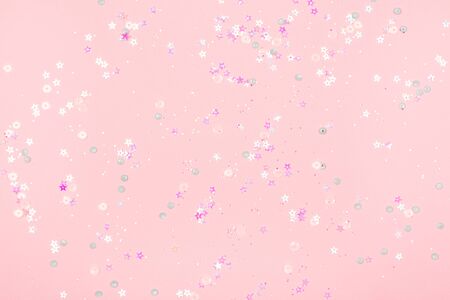 Pink background with delicate holographic sparkles. Perfect for backdrop for your design.の写真素材