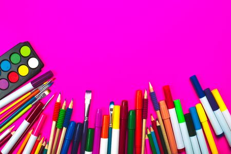School supplies on pink neon background and note book with copy space. Back to school concept.の写真素材