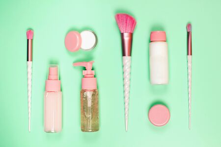 Care cosmetics in bottles on a delicate green background.の写真素材