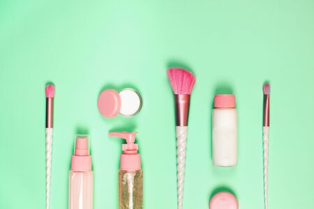Care cosmetics in bottles on a delicate green background.の写真素材