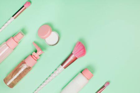 Care cosmetics in bottles on a delicate green background.の写真素材