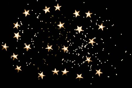 Black background with gold stars. Perfect star overlay.の写真素材