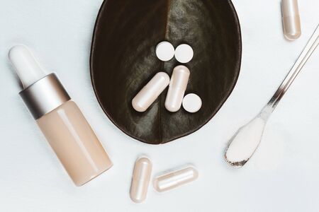 Different types of collagen. Powder, capsules, tablets and fluid.の写真素材