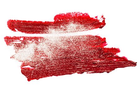 Smear of red lipstick with glitter. Cosmetics concept. Element isolated on white.の写真素材