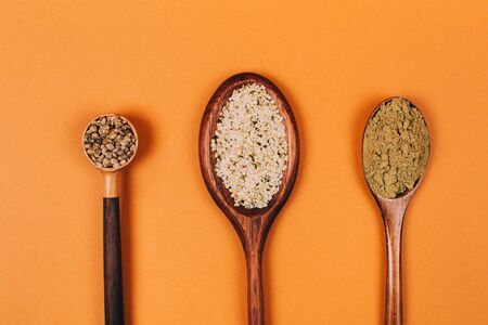 Different types of uses for hemp. Seeds, protein and powder in wooden spoons.の写真素材